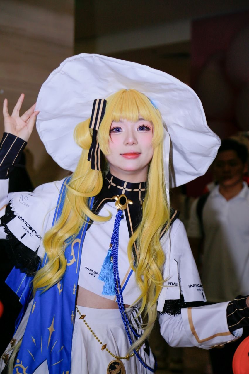 Blue, white and gold character costume with a wide white hat