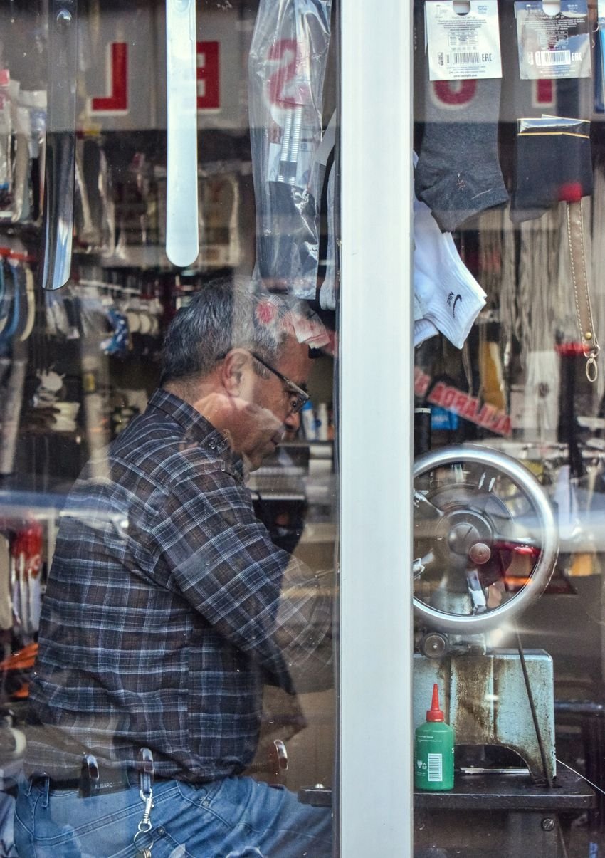 Experienced craftsperson working among specialist tools